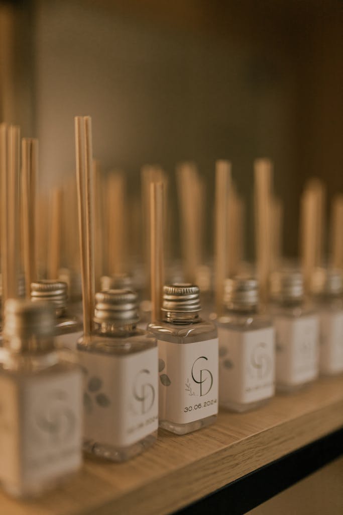 Stylish diffuser bottles arranged on a shelf, creating a warm and serene atmosphere.
